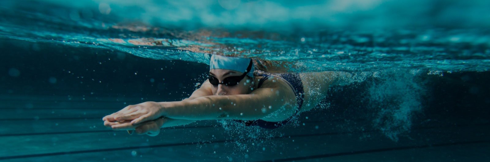 Person swimming in pool